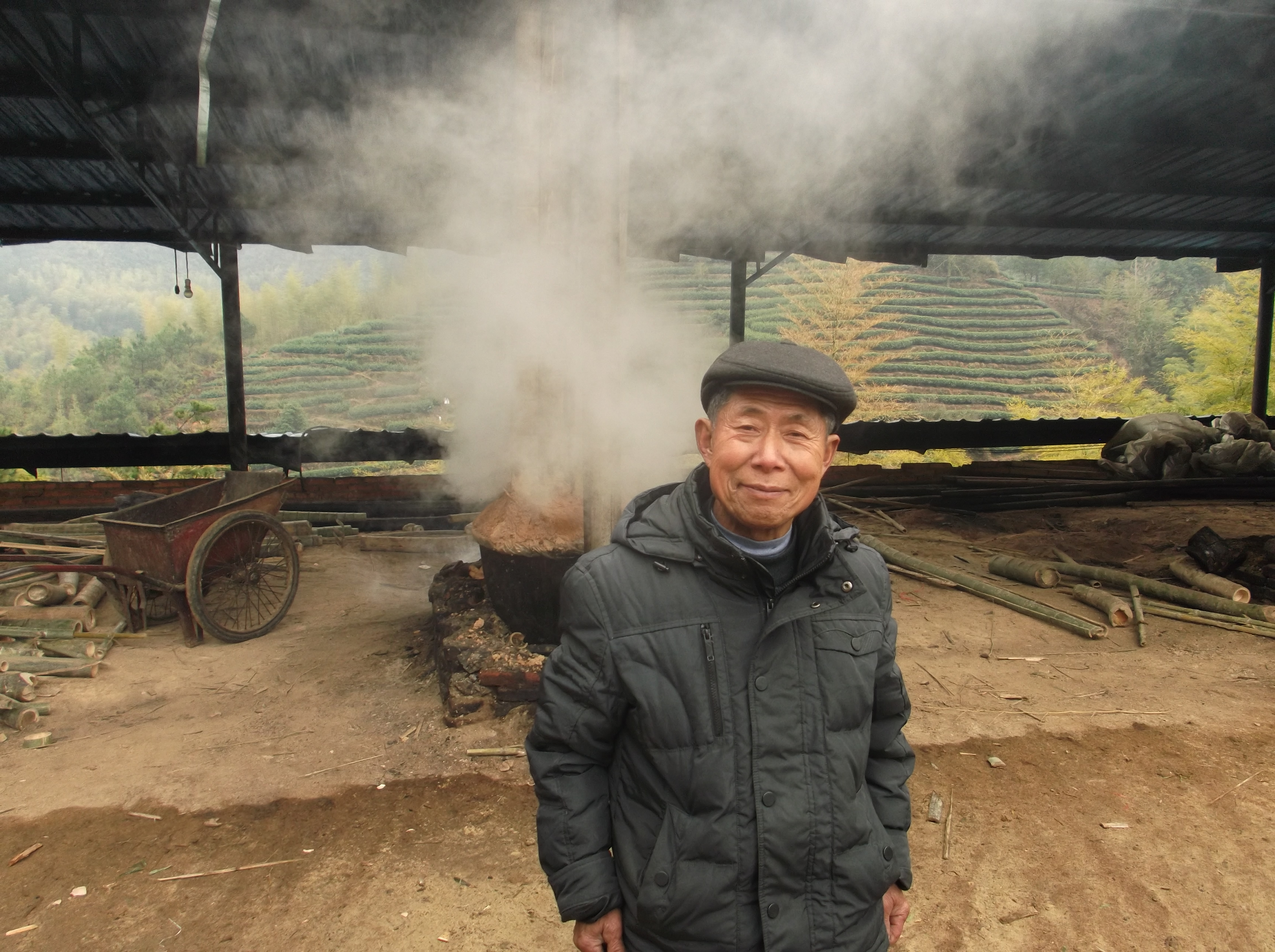 Mr Weng in front of his charcoal kiln